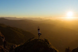 Lady on top of a mountain