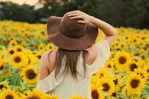 Lady in field of sunflowers 