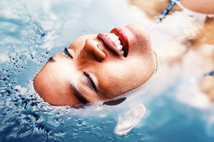 Woman lying in water