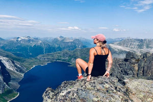 Woman on top of mountain
