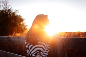 Lady watching the sun rise