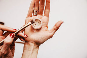 Woman's hand with makeup