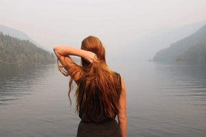 Woman looking at a lake
